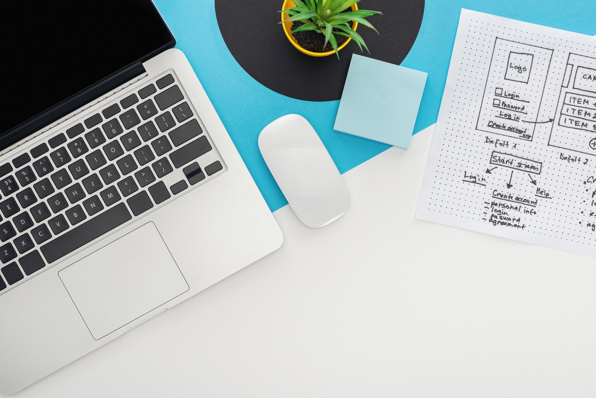 Top view of laptop, computer mouse, plant, website design template on abstract geometric background